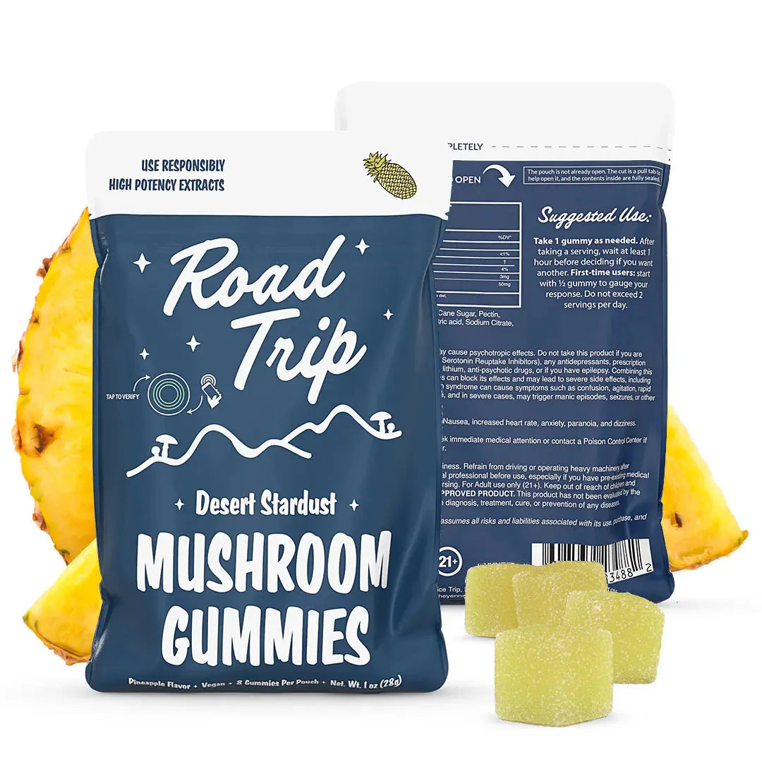 Road Trip Desert Stardust mushroom gummies Pineapple flavor pouch with pineapple gummy candies, fresh pineapple slices, psychedelic inspired mushroom edible packaging, and premium tropical fruit flavored gummy display