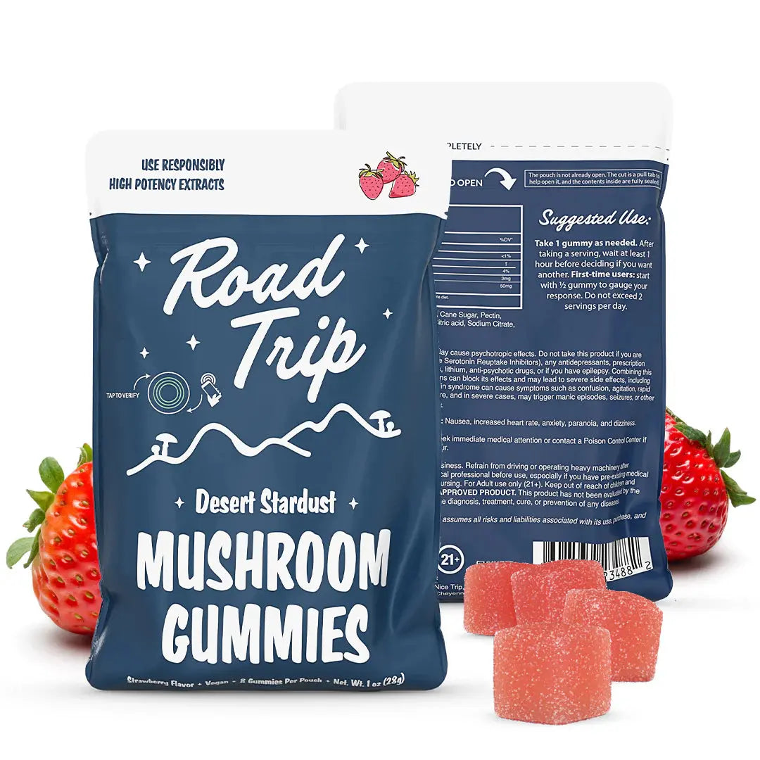 Road Trip Desert Stardust mushroom gummies Strawberry flavor pouch with strawberry gummy candies, fresh strawberries, psychedelic inspired mushroom edible packaging, and premium fruit flavored gummy display