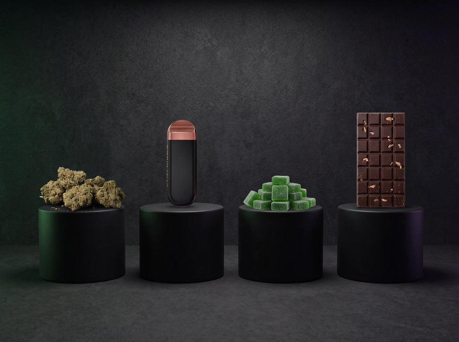 Premium hemp product categories displayed on black pedestals featuring indoor THCA flower, a disposable vape, gummies, and mushroom chocolate in a modern studio setting.